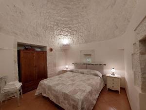 Una cama o camas en una habitación de Trulli Chiafele