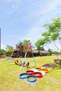 a group of different colored frisbees on a field at Casa De Cortijo Family Room in Pagbilao