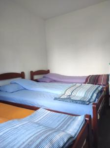 Postel nebo postele na pokoji v ubytování Apartmani Vila Šljukić