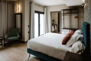 Ένα ή περισσότερα κρεβάτια σε δωμάτιο στο Hotel GilMar Orellana la Vieja