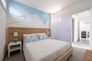 A bed or beds in a room at Venti di Laguna