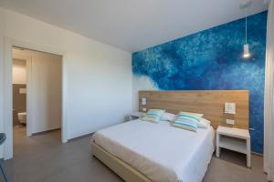 A bed or beds in a room at Venti di Laguna