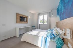 A bed or beds in a room at Venti di Laguna