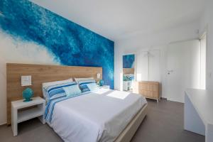 A bed or beds in a room at Venti di Laguna