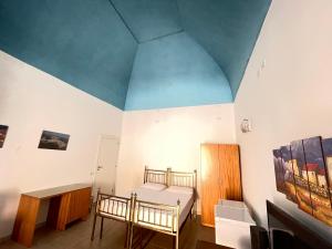 a room with a bed and a table in it at GALLIPOLI DUESTANZE in Gallipoli