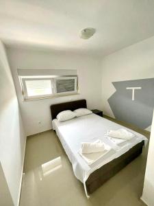 Postel nebo postele na pokoji v ubytování Vip Villa Tina