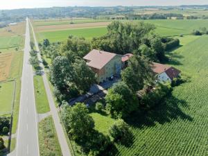 an aerial view of a house in a field with a road at Villa Quintana in Künzing