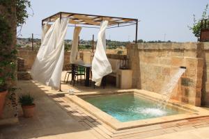 The swimming pool at or close to Dimora Sighé, exclusive rural villa with hydromassage pool