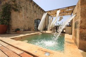 The swimming pool at or close to Dimora Sighé, exclusive rural villa with hydromassage pool
