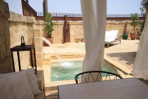 The swimming pool at or close to Dimora Sighé, exclusive rural villa with hydromassage pool