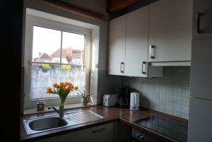 Kuchyň nebo kuchyňský kout v ubytování Ferienhaus Hooksiel + 8 fotografií