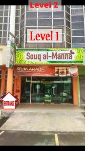 a store front of a building with a sign at Pak Long Shoplot Homestay 2 in Shah Alam