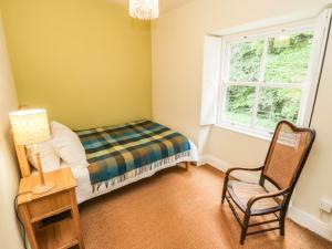 Katil atau katil-katil dalam bilik di Snowdrop Cottage