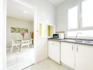 Kuchyňa alebo kuchynka v ubytovaní San Marcos Apartamentos