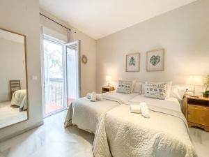 Posteľ alebo postele v izbe v ubytovaní San Marcos Apartamentos