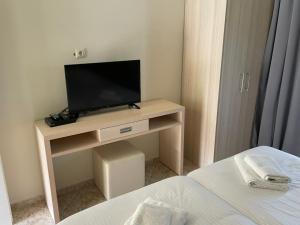 A television and/or entertainment centre at ANGELIKA HOUSE 2