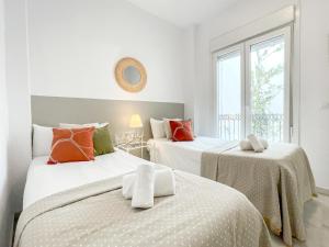 Posteľ alebo postele v izbe v ubytovaní San Marcos Apartamentos