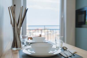 TV a/nebo společenská místnost v ubytování Occhi sul mare Apartment