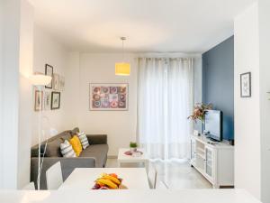 Televízia a/alebo spoločenská miestnosť v ubytovaní San Marcos Apartamentos