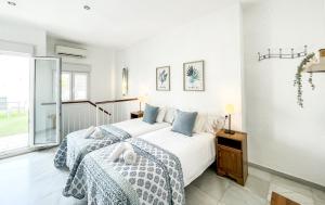 Posteľ alebo postele v izbe v ubytovaní San Marcos Apartamentos