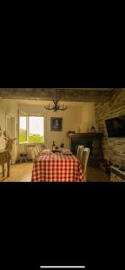 a dining room with a table and chairs and a window at la baita nei boschi in Serramazzoni