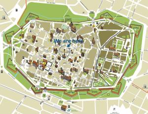 a map of a city with the words we are here at Il nido in centro in Lucca