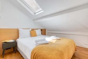 เตียงในห้องที่ Les Cottages de Montmartre - Secret Courtyard