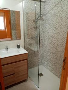 a bathroom with a shower and a sink at La Villa Rosace in Cerbère