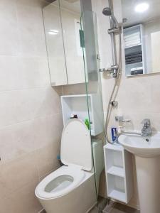 a small bathroom with a toilet and a sink at Gyeongbokgung Palace Seochon Christian Home - Foreigner Only in Seoul