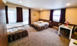 Ένα ή περισσότερα κρεβάτια σε δωμάτιο στο Apartments Alf - Om