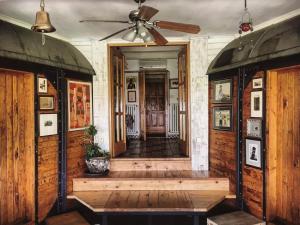 a hallway of a house with a ceiling fan at Train_house_ns in Petrovaradin