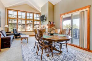 a living room with a wooden table and chairs at Eagle Springs East 315: Osprey Suite in Solitude