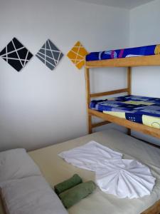 Postel nebo postele na pokoji v ubytování Hostal azul beach isla baru + 21 fotografií