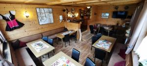 an overhead view of a restaurant with tables and chairs at Chalet Auhof Flachau in Flachau