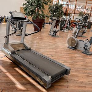 a gym with several treadmills and machines at Resort Hotel IV Jahreszeiten Zingst in Zingst