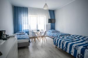Postel nebo postele na pokoji v ubytování VillaDudek