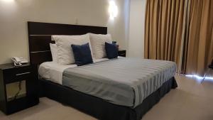 Voodi või voodid majutusasutuse May Palace Hotel  toas