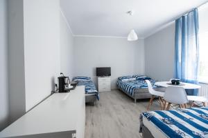 Postel nebo postele na pokoji v ubytování VillaDudek