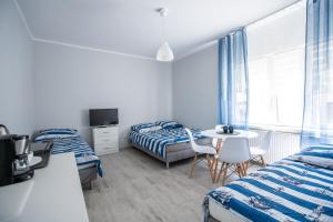 Postel nebo postele na pokoji v ubytování VillaDudek