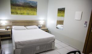 Voodi või voodid majutusasutuse Hotel Baeza toas
