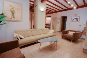 a living room with a couch and a chair at Casa Paquita in Calpe