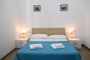 A bed or beds in a room at La residenza del Principe