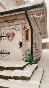 a door to a house with a heart on it at Karczma Kubalonka in Istebna