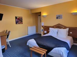 Postel nebo postele na pokoji v ubytování L'AUBERGE DE L'OLIVE
