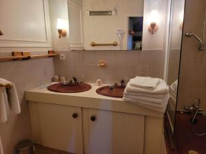 Koupelna v ubytování L'AUBERGE DE L'OLIVE