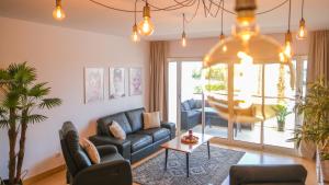 a living room with a couch and a table at Lucky Star Marina Apartment, with Pool in Lagos