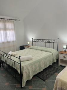 Letto o letti in una camera di Agriturismo Su Barraccu