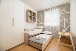 a small room with two beds and a ladder at Holiday home Paligan in Solin +38 photos