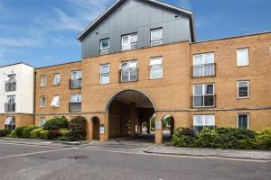 a large brick building with an arch entrance at The Kenway in Southend-on-Sea