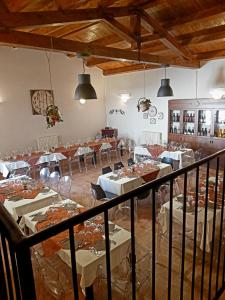 a dining room with white tables and chairs at Al Convento in San Mauro Castelverde
